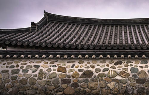 Completed residential roof with modern shingles